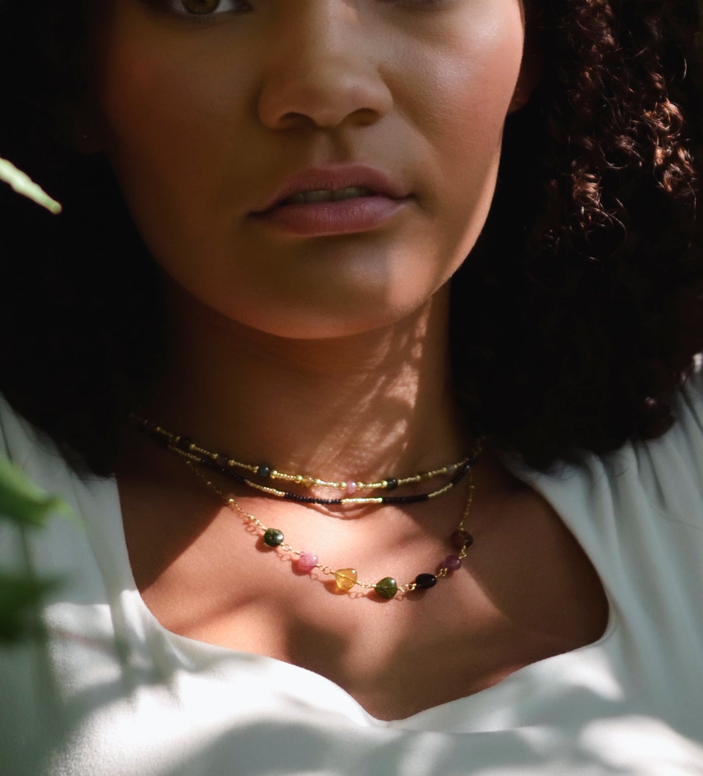 Multi color Tourmaline drops chain necklace. Shown in gold. Stone colors include: pink, green, black, yellow, or brown.