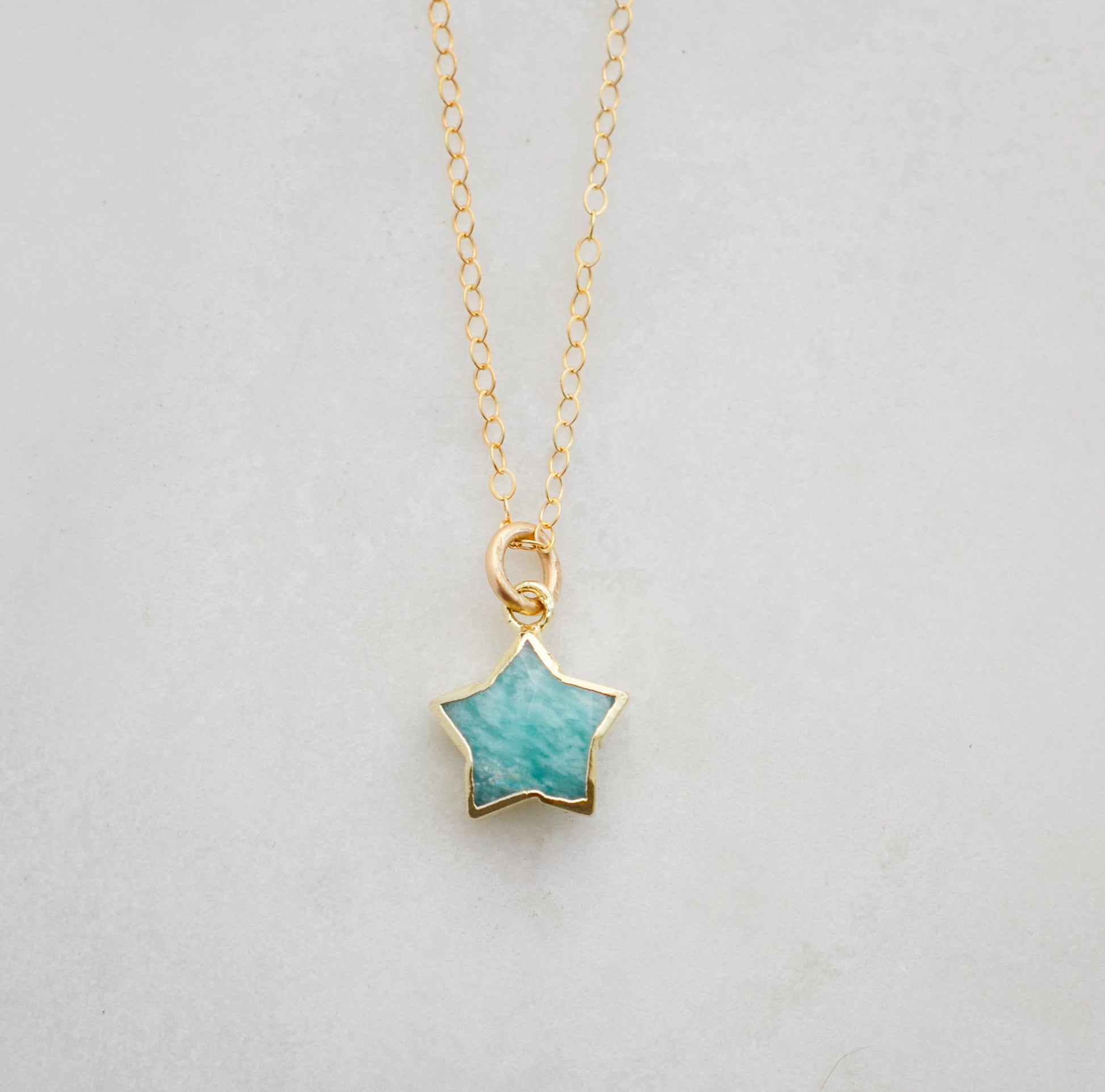 Natural blue aqua amazonite celestial star pendant set on a 14k gold filled chain. This necklace is a great gift for stargazers and dreamers.