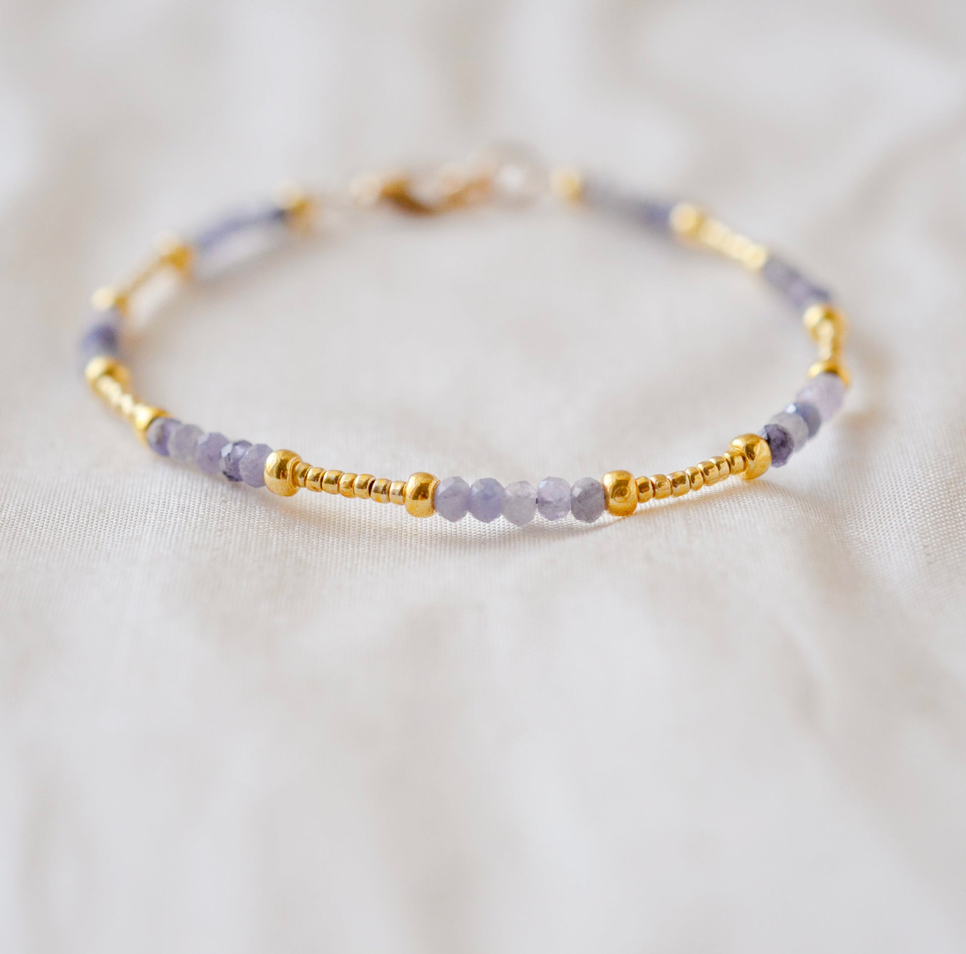 Handmade beaded gemstone crystal bracelet in gold filled or sterling silver. These bracelets feature a gemstone of your choice on a bracelet that can be stacked with others or worn alone.