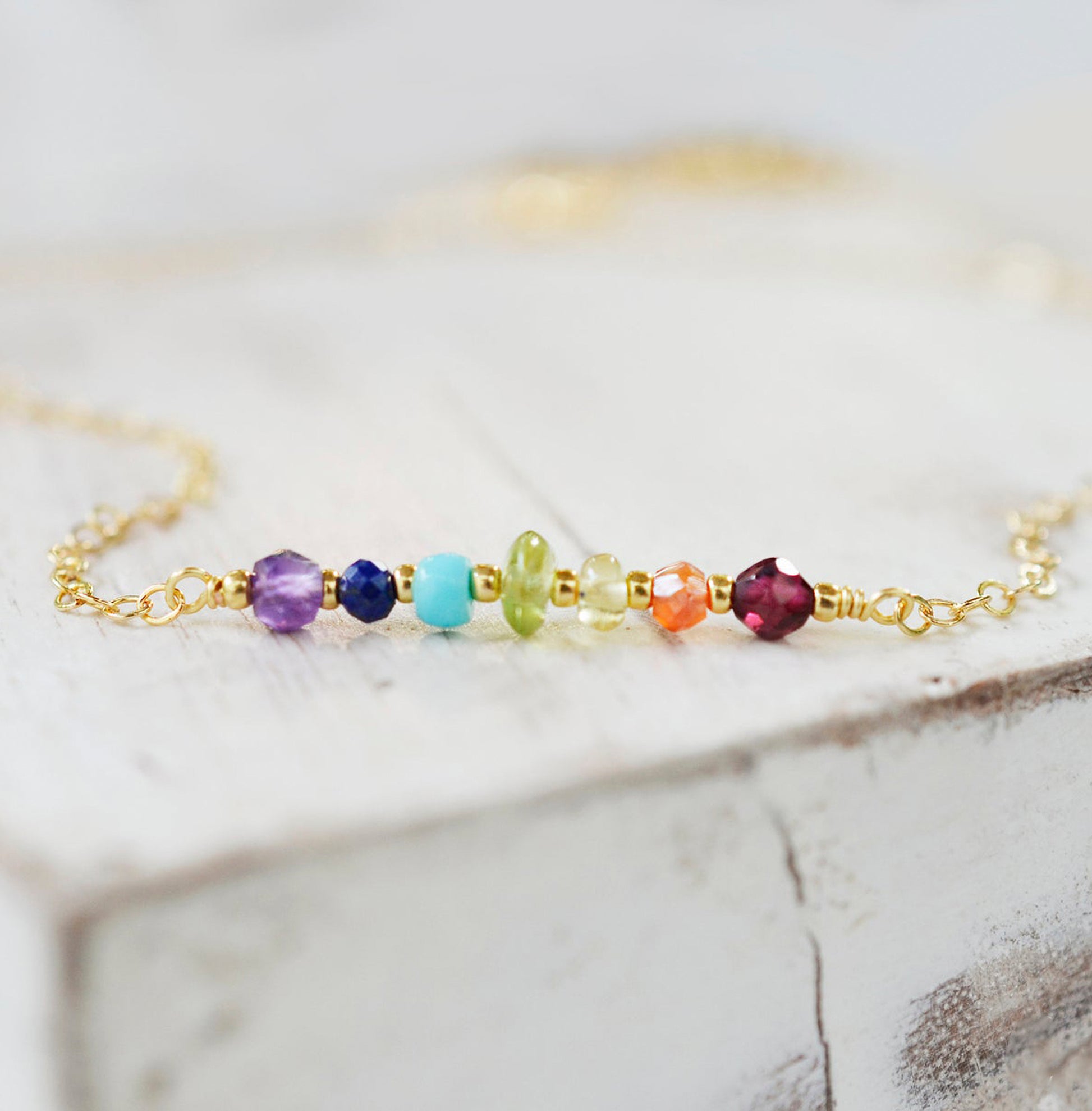 Rainbow Crystal Chakra Necklace, Handmade by GEMNIA. Stone chakra pendant on gold or silver chain.