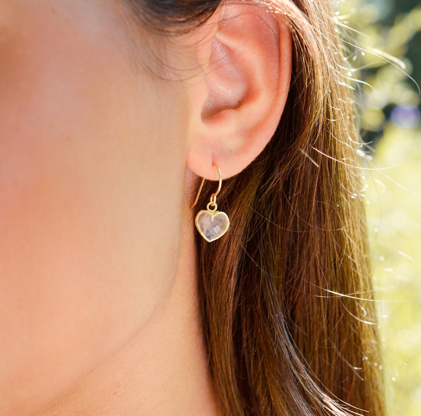 Dainty, handcrafted rose quartz heart earrings featuring a faceted, sparkling heart—the stone of universal love. These gentle dangles, approximately 0.5 inches (12mm/1.2cm) in size, are modeled in 14k gold filled. They make a sweet and romantic gift for wife, girlfriend, or anniversary.