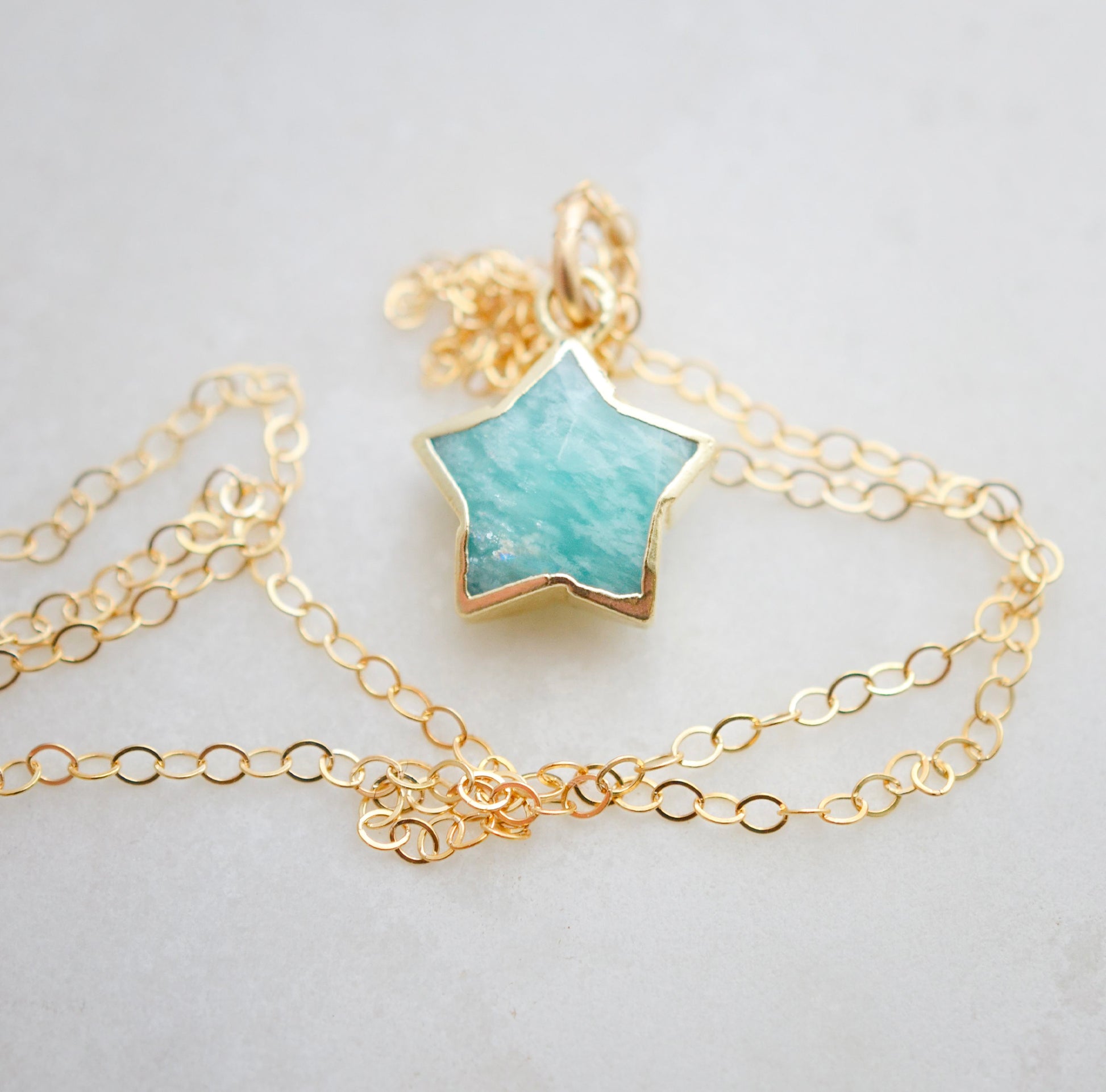 Genuine blue green amazonite celestial gemstone star pendant set on a 14k gold filled chain. This necklace is a great gift for stargazers, girlfriend, mom, wife, or daughter.