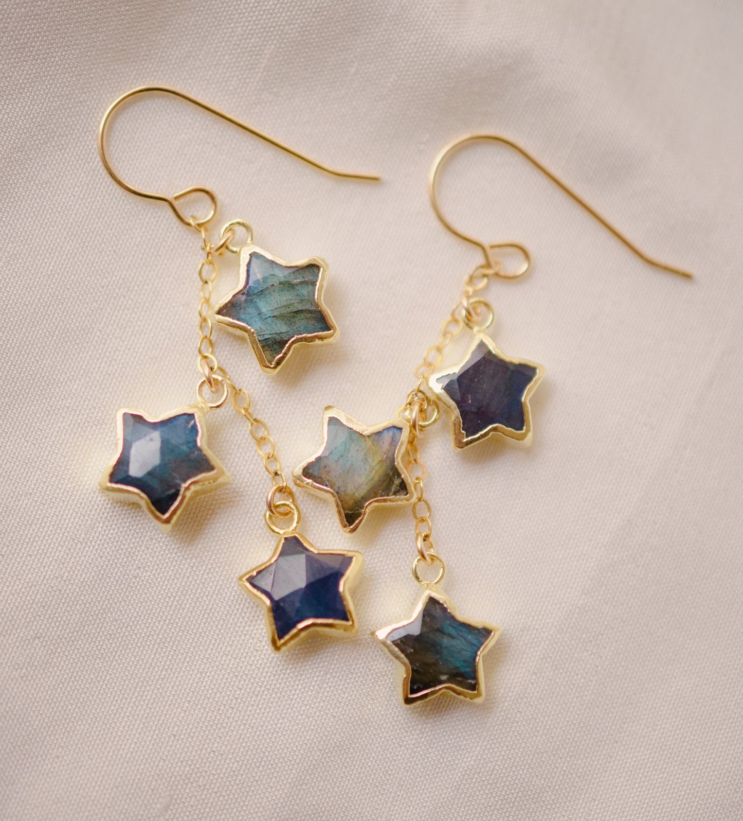 Three labradorite star shaped gemstones hang from each earring. Shown in gold filled.
