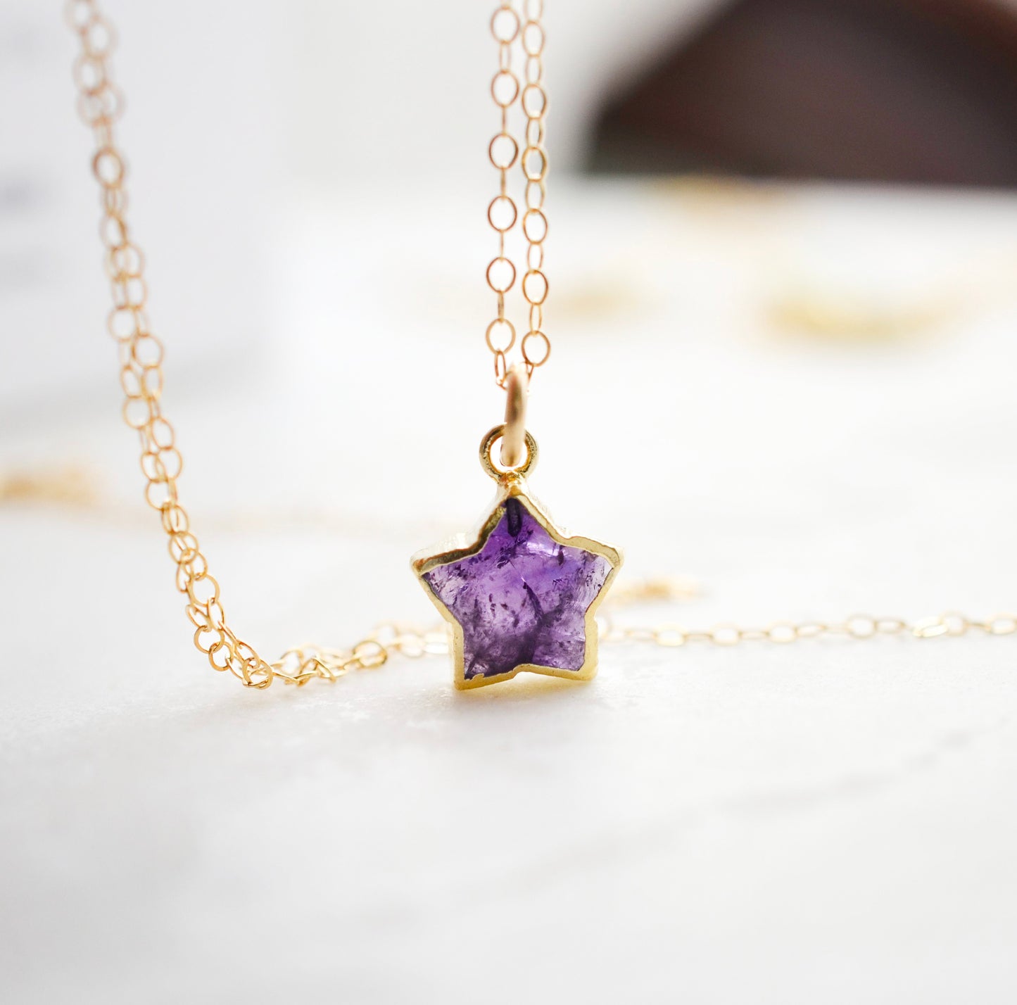 Handmade genuine purple amethyst star pendant set on a 14k gold filled chain. This necklace is also available in sterling silver.