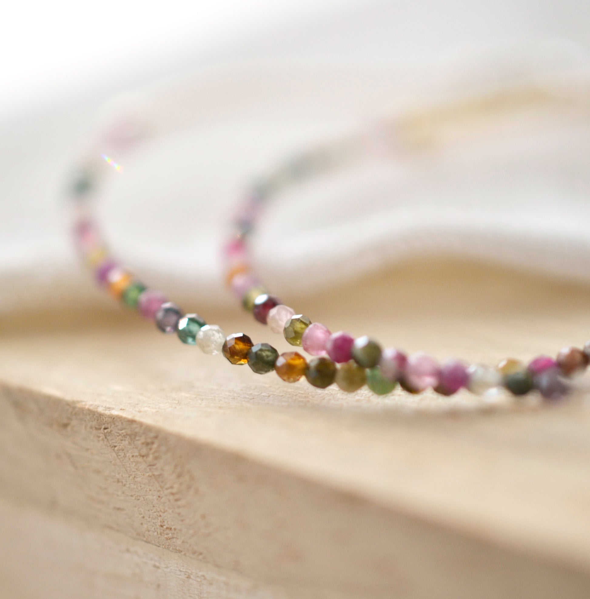 Close up of Tourmaline stones. Colors include: pink, green, brown, and clear.