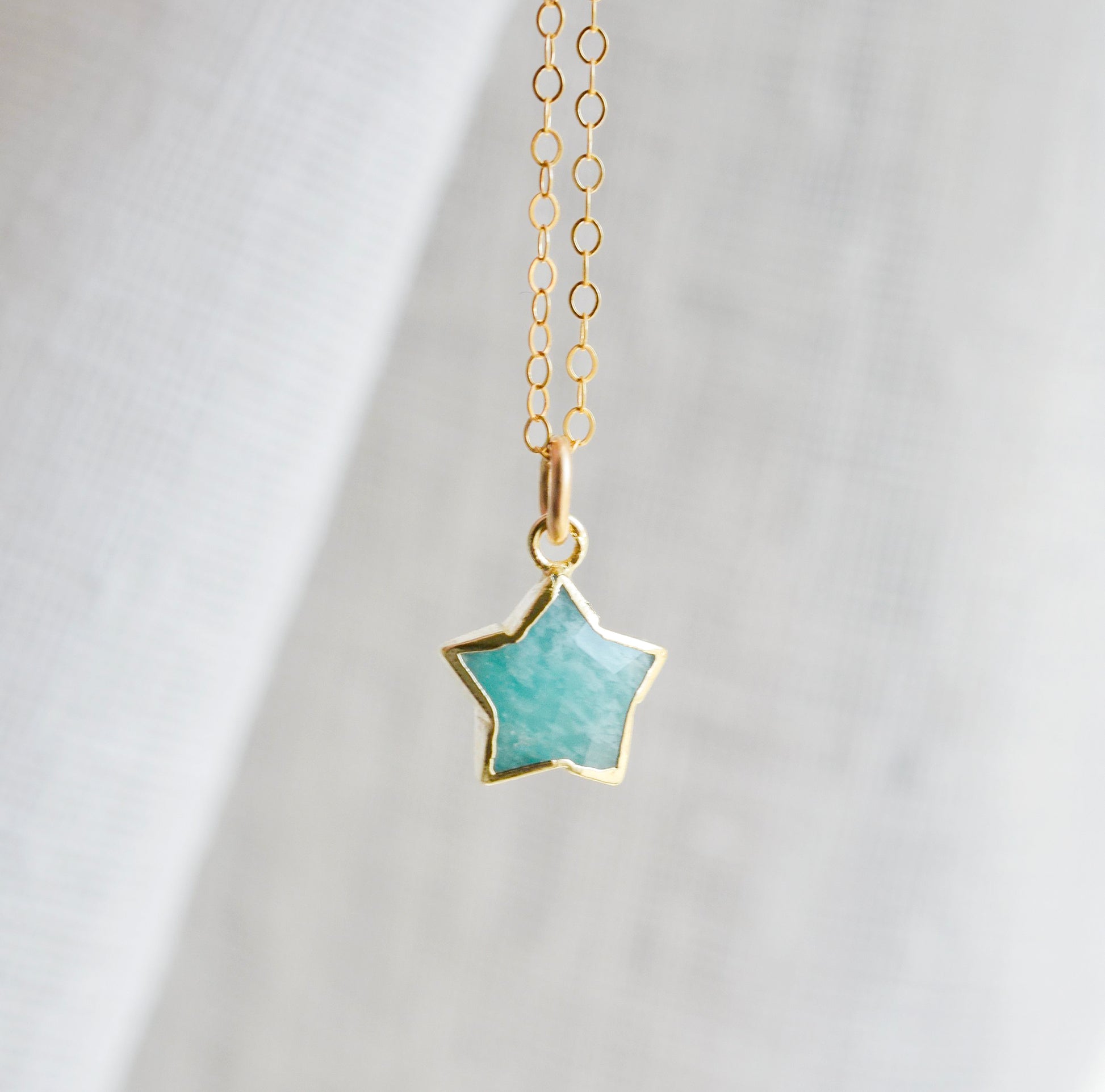 Dainty, natural aqua amazonite celestial stone star pendant set on a 14k gold filled chain. This necklace is a great gift for stargazers, girlfriends, mom, wife, or daughter.
