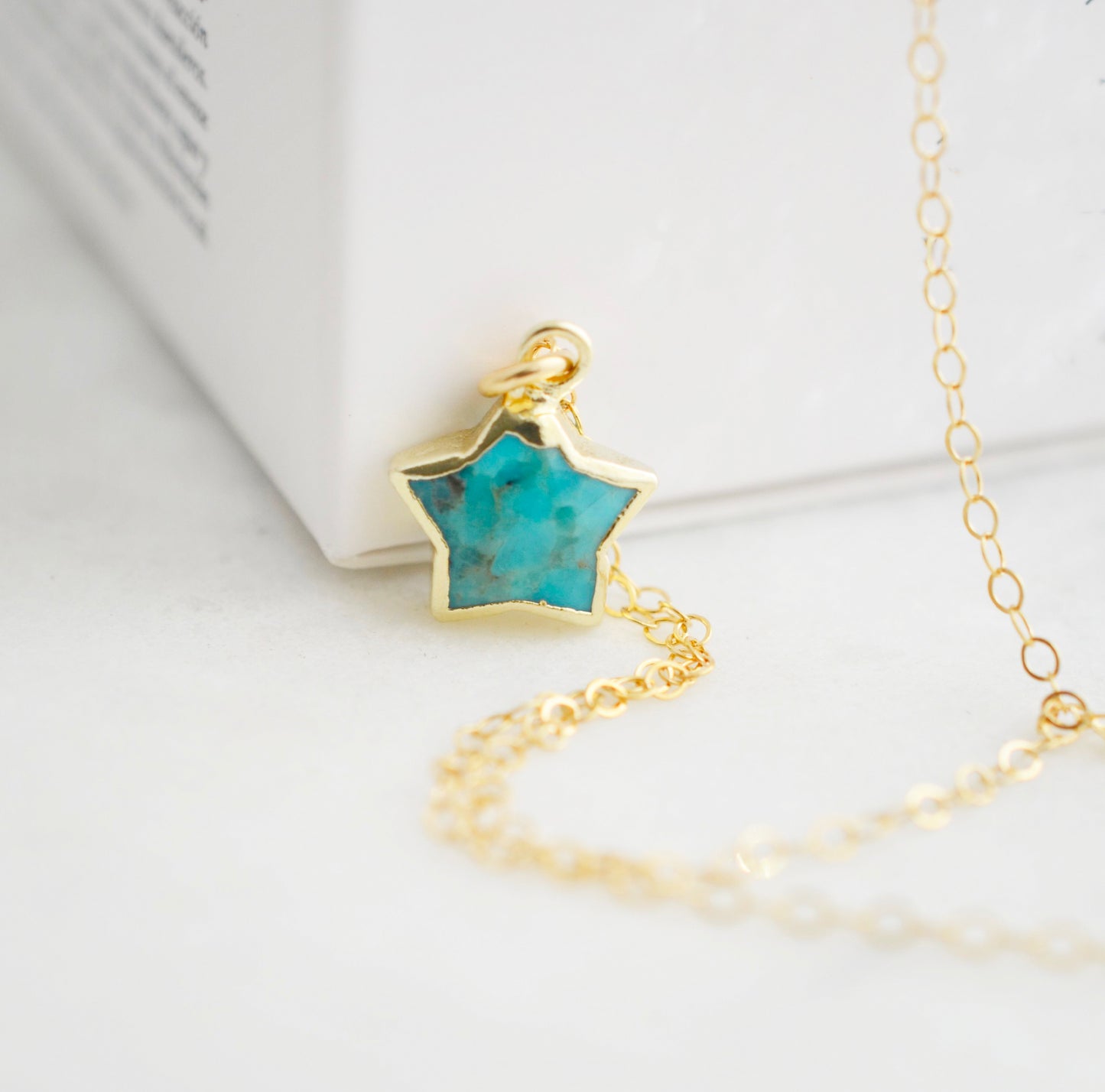Genuine handmade blue turquoise star pendant on a 14k gold filled chain.