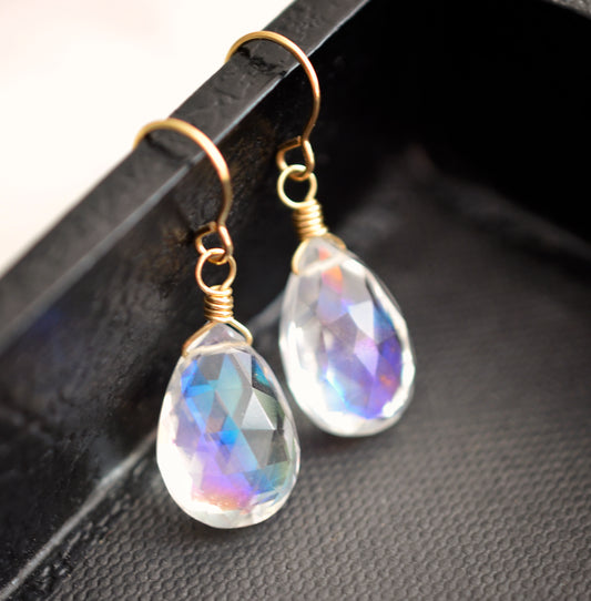Rainbow colored mystic topaz earrings in 14k gold filled. The stone is a teardrop shape and shifts different rainbow colors..