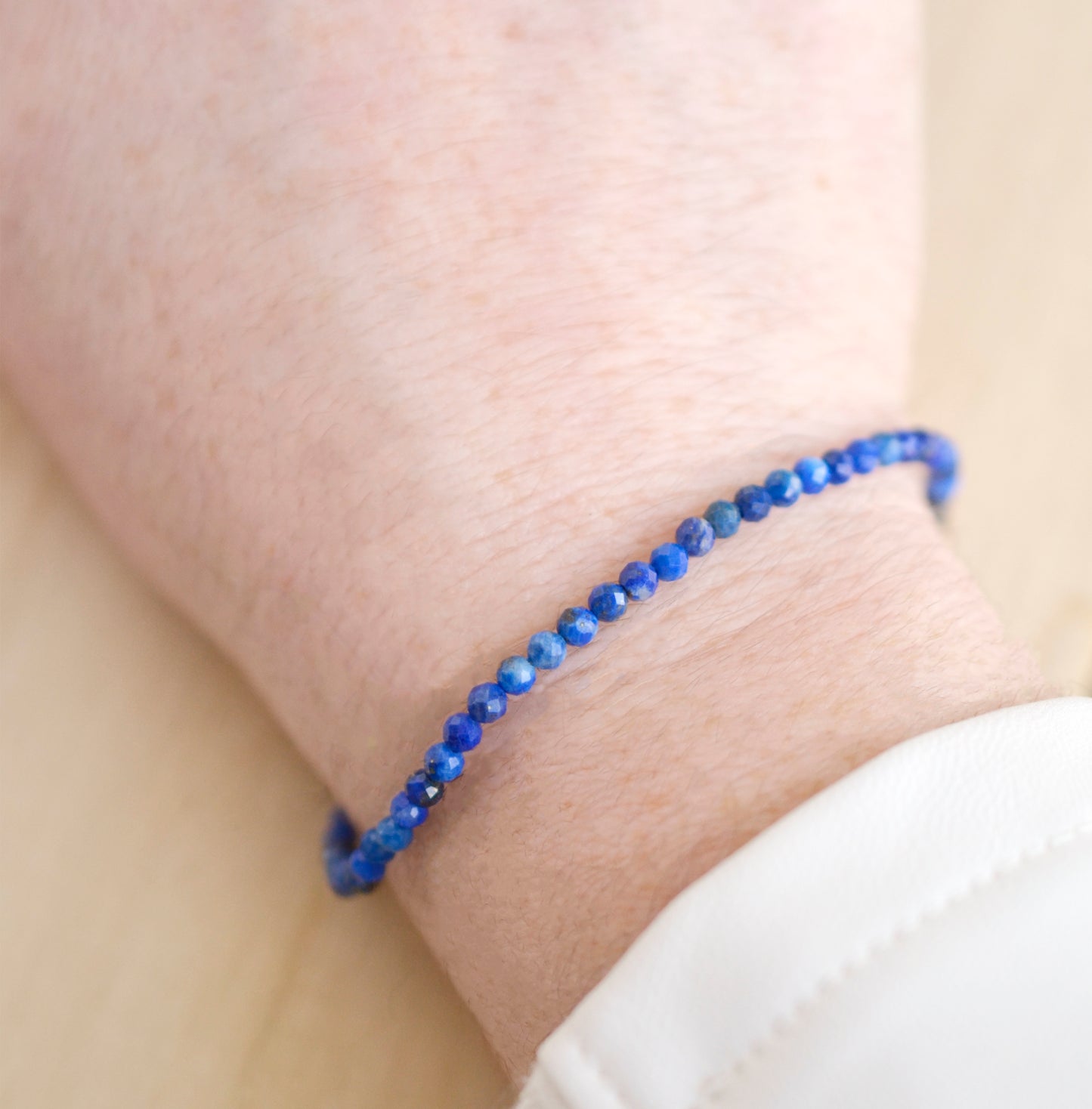 Minimalist Lapis Lazuli bracelet. Handmade with small 3mm natural lapis beads and set onto a sterling silver or 14k gold filled clasp.