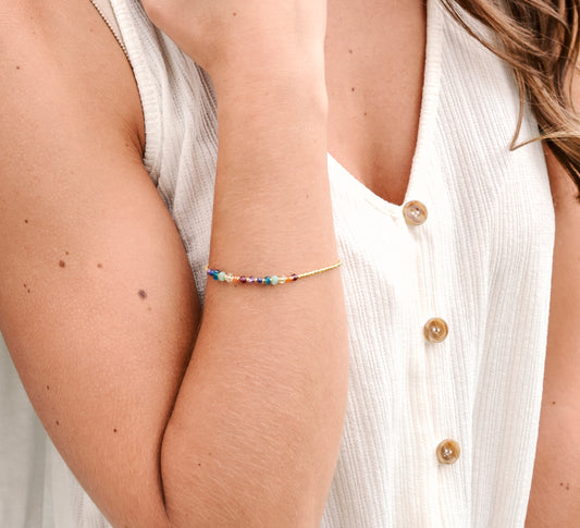 Real Gemstone Chakra or Rainbow Pride Bracelet. Handmade with garnet, carnelian, CZ, emerald, topaz, lapis lazuli, and amethyst in gold or silver.