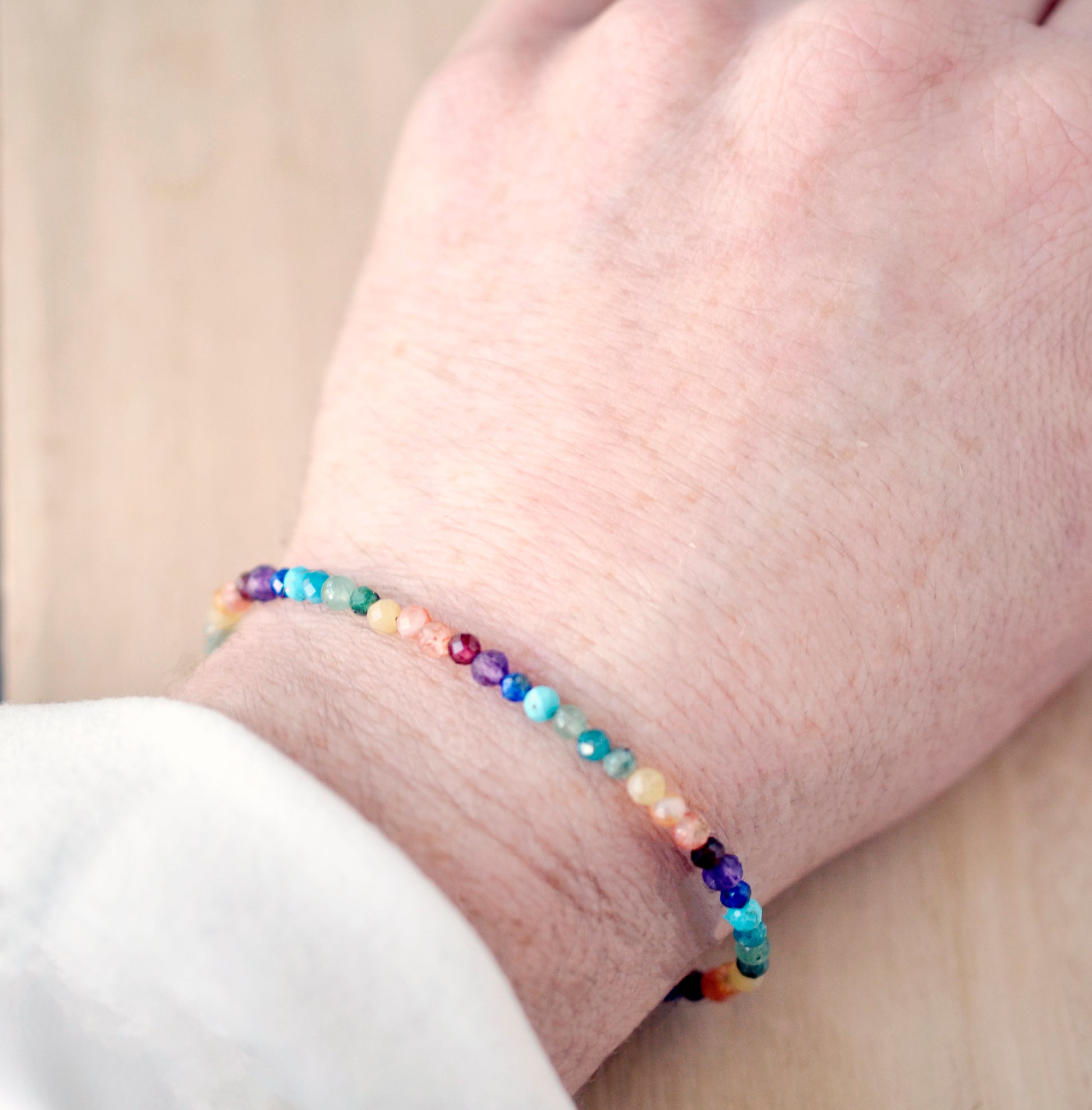 Mulit color beaded gemstone bracelet. Rainbow, pride delicate bracelet handmade with turquoise, apatite, emerald, garnet, yellow opal, amethyst, aventurine, and lapis lazuli.