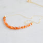 Close up of the faceted sunstone crystals set onto a gold filled necklace chain. 