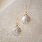 Natural white freshwater pearl dangle earring. The pearl is set in 22k gold electroplate and suspended from 14k gold filled earwires. 