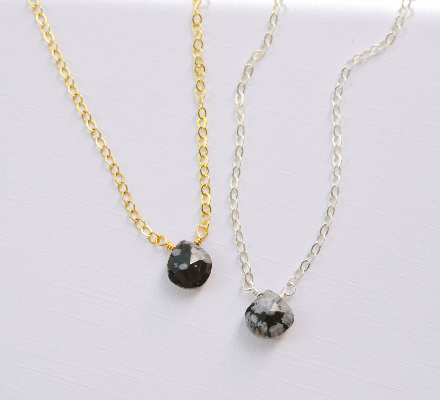 Genuine tiny snowflake obsidian necklaces in gold or silver. The gemstone is a small faceted teardrop.