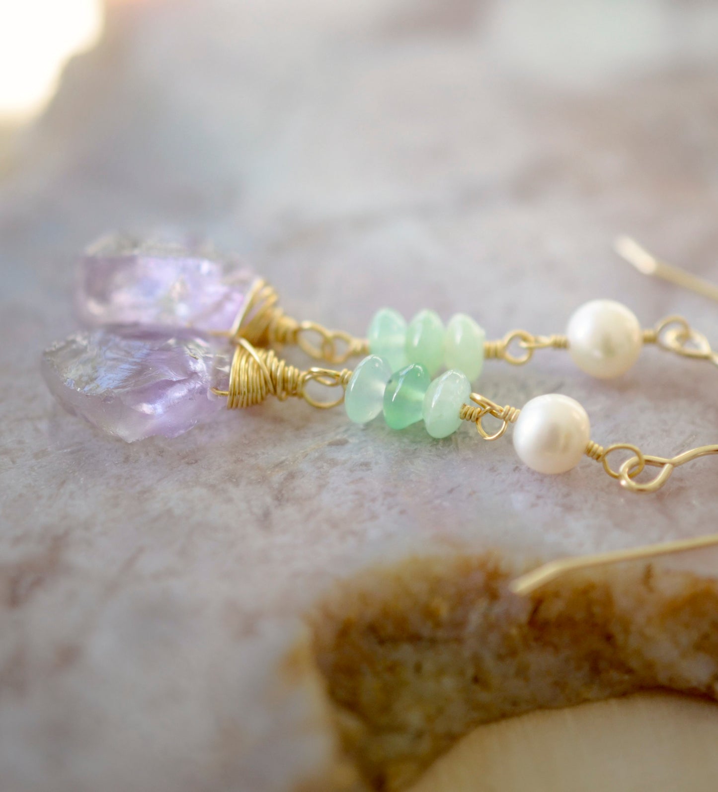 Close of of gold wire-wrapped raw Amethyst crystals with green Chrysoprase and freshwater Pearls.