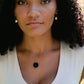 Smooth Polished Black Onyx Circle Pendant on Simple Gold Chain. Modeled Image.
