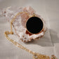 Smooth Polished Black Onyx Circle Pendant on Simple Gold Chain. 