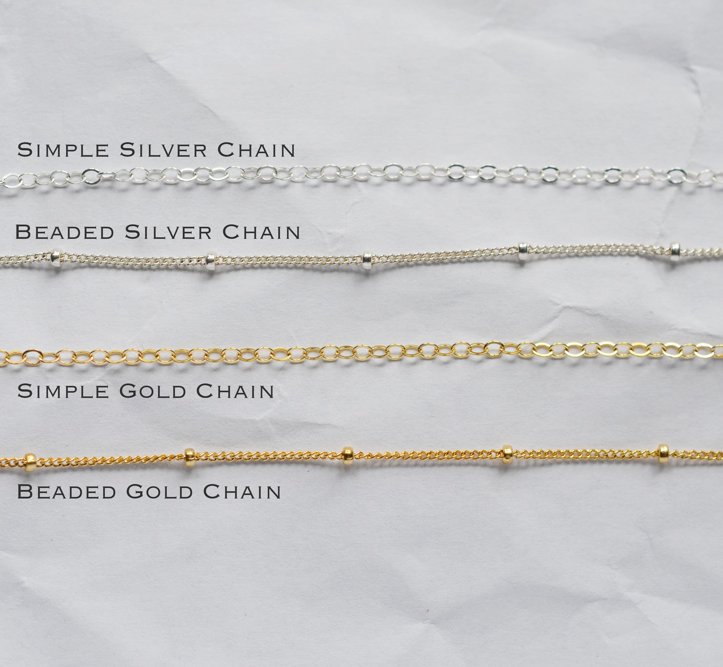 Chain options for the necklace. A simple chain is a cable chain. The beaded chain has small beads dotting the chain.