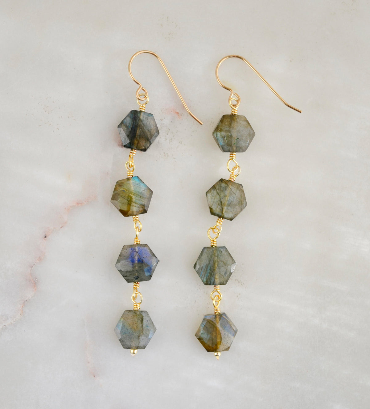 Long labradorite earrings with hexagon shaped gemstones in a long dangle style. The metal is 14k gold filled or sterling silver. 