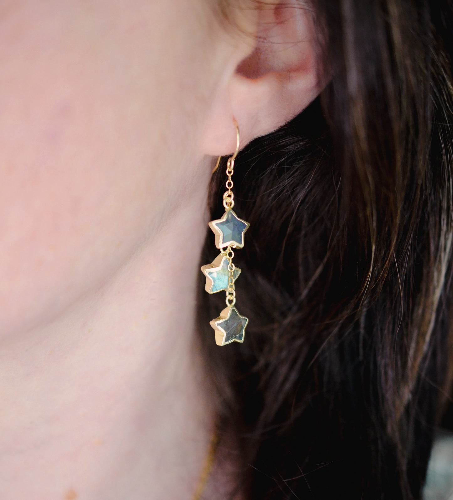 Three labradorite star shaped gemstones hang from each earring. Shown in gold filled. Modeled image.