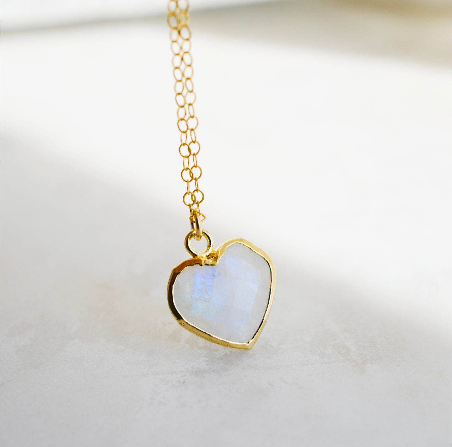 Natural handmade rainbow moonstone heart-shaped pendant necklace with 14k gold filled chain. Handmade in New England by Gemnia Jewelry. 