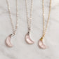 Three genuine pink rose quartz crescent moon necklaces shown in sterling silver or 14k gold filled. These dainty celestial pendants are handmade by Gemnia in Connecticut.