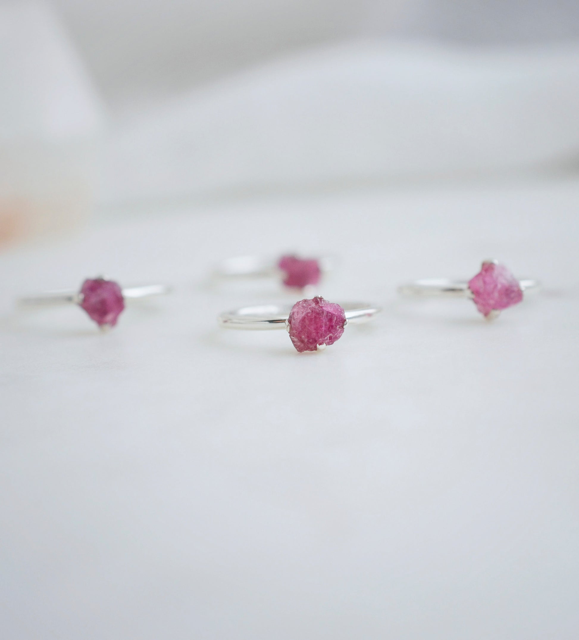 Four separate pink Tourmaline rings with raw crystals set in sterling silver.