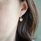 Dainty, handcrafted rose quartz heart earrings featuring a faceted, sparkling heart—the stone of universal love. These gentle dangles, approximately 0.5 inches (12mm/1.2cm) in size, are modeled in 14k gold filled and are also available in sterling silver. They make a sweet and thoughtful gift for someone special. 