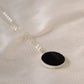 Smooth Polished Black Onyx Circle Pendant on Simple Silver Chain. 