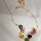 Multi color Tourmaline drops chain necklace. Shown in gold. Stone colors include: pink, green, black, yellow, or brown.