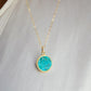 Round aqua blue Turquoise set into a gold bezel and suspended from a 14k gold filled chain.