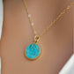 Round aqua blue Turquoise set into a gold bezel and suspended from a 14k gold filled chain.