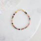 Handmade watermelon tourmaline bracelet in pink, green, brown, and black. Top view. Shown in gold.