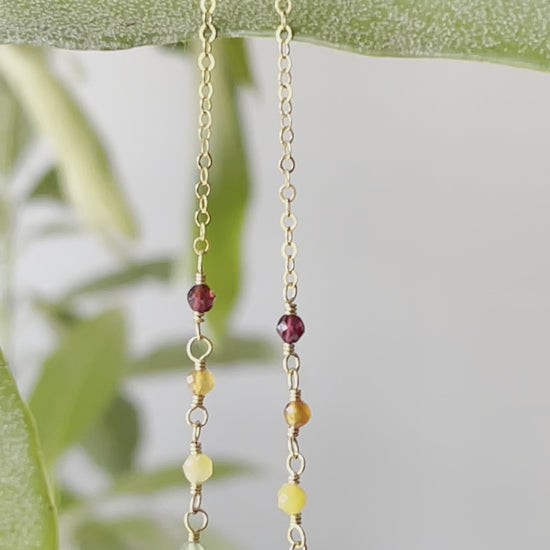 Rainbow, pride, or chakra necklace with tiny gemstones and a white freshwater pearl. The 14k gold filled style is shown. Video
