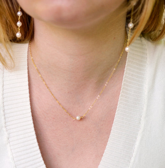 Single round white freshwater pearl necklace on a 14k gold filled chain.