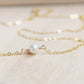 Single round white freshwater pearl necklace on a 14k gold filled chain.