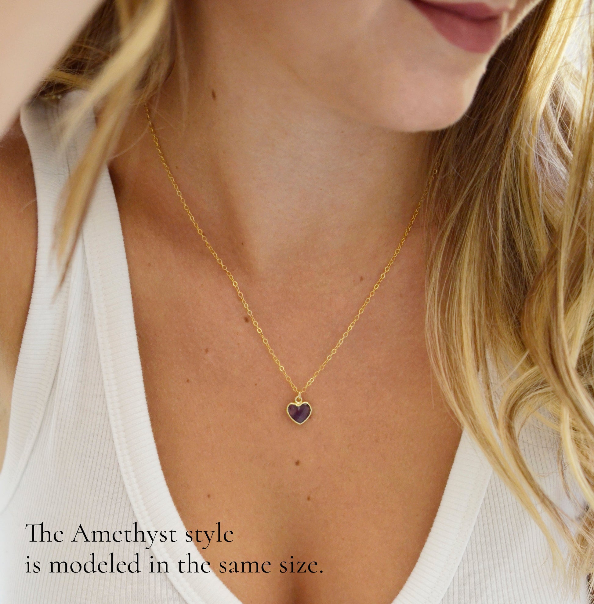 Natural pink Rose Quartz heart pendant suspended on a 14k gold filled chain. Modeled image.