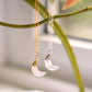 A close up of two rose quartz moon crescent necklaces in sterling silver and 14k gold filled. Each pendant is handmade by Gemnia in Connecticut.