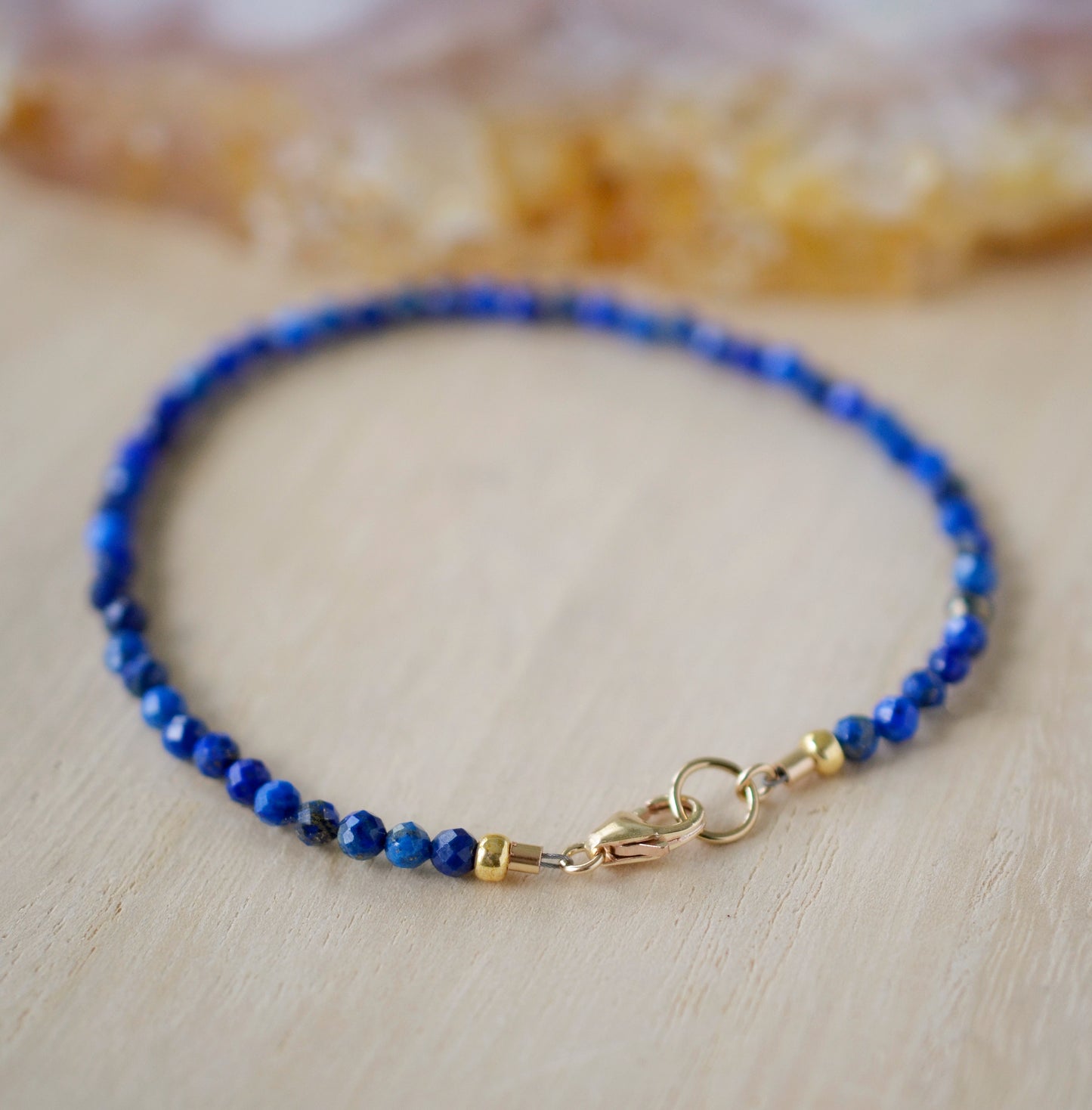 Minimalist Lapis Lazuli bracelet. Handmade with small 3mm natural lapis beads and set onto a sterling silver or 14k gold filled clasp.