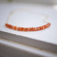 Sunstone Necklace with small faceted sunstone gems set onto a sterling silver or gold filled chain. 